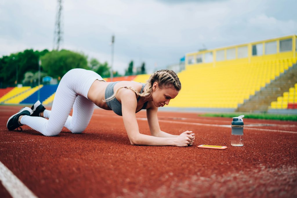 Focused sportswoman training at stadium